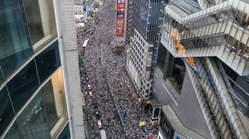 Protesters march during a rally against a controversial extradition law proposal in Hong Kong, June 9, 2019.